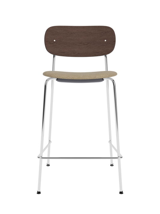 Co Counter Chair with a chrome frame, dark stained oak wood back, and Audo Bouclé 02 upholstered seat.