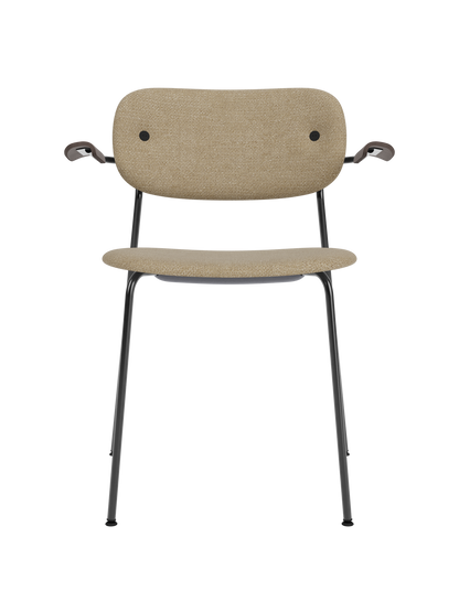 Fully upholstered Co Dining Chair with armrests, featuring beige bouclé fabric and dark stained oak on a black frame.