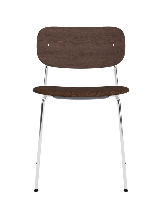 Co Dining Chair with chrome frame, dark stained oak backrest and dark bouclé upholstered seat on a white background.