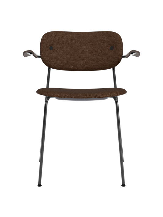 Co Dining Chair with armrests, upholstered in dark Audo Bouclé 07 with dark stained oak details and black frame.