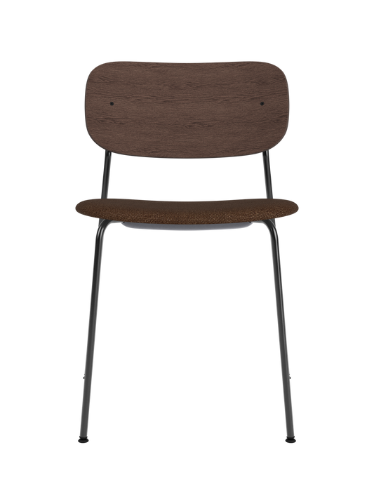 Co Dining Chair featuring a black steel frame, curved dark stained oak backrest and brown bouclé upholstered seat.