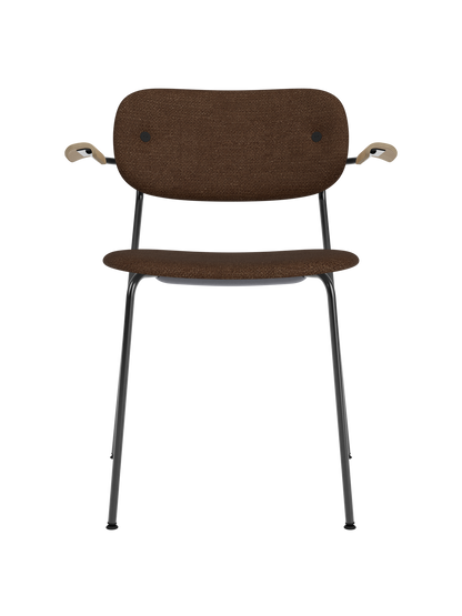 Co Dining Chair with black bouclé upholstery, natural oak armrests, and a sleek black powder-coated steel frame.