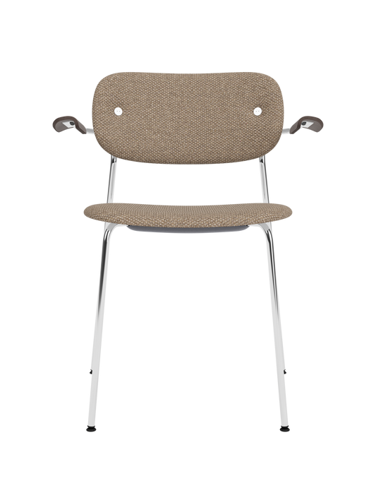 Fully upholstered Co Dining Chair with a chrome frame, dark stained oak armrests and textured Logan Flint fabric.