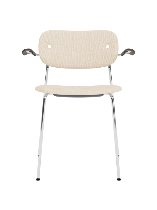 Co Dining Chair with armrests, featuring Logan Jasmine upholstery, dark stained oak armrests and a chrome frame.