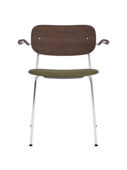 Co Dining Chair with armrests, featuring a chrome frame, dark-stained oak back and olive Sierra leather seat.