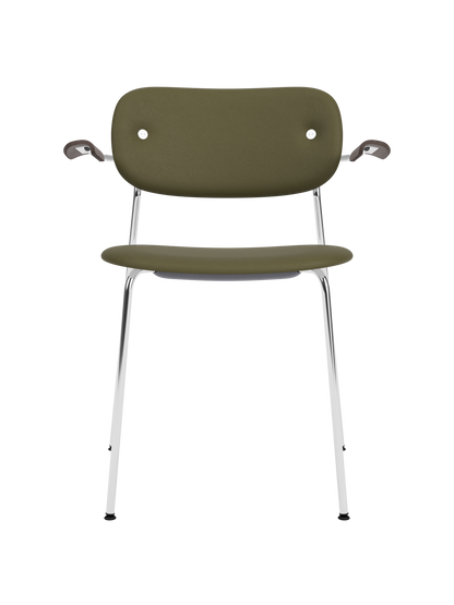 Co Dining Chair with armrests, olive green leather upholstery and dark stained oak arms on a chrome frame.