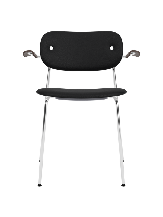 Fully upholstered Co Dining Chair with black Sierra leather, a chrome frame and dark stained oak armrests.