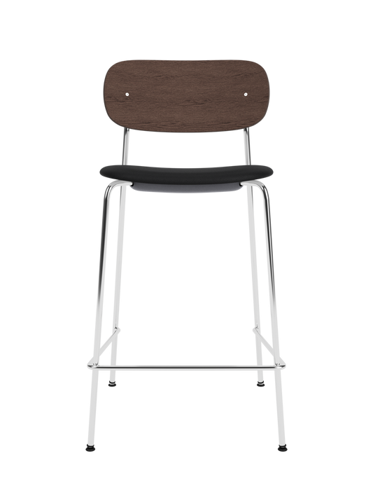 Co Counter Chair with a chrome frame, dark stained oak back, and Sierra 1001 upholstered seat against a black background.