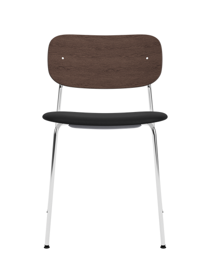 Co Dining Chair featuring a dark-stained oak backrest, black upholstered seat and a slim chrome frame.
