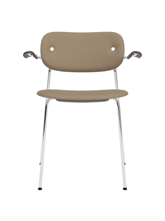 Fully upholstered Co Dining Chair with chrome frame, dark stained oak armrests and tan Sierra 1611 leather.