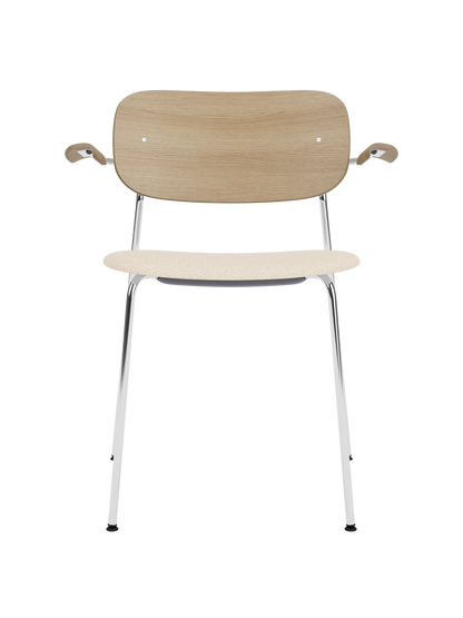 Co Dining Chair with a chrome frame, natural oak backrest and Logan Jasmin upholstered seat and armrests.
