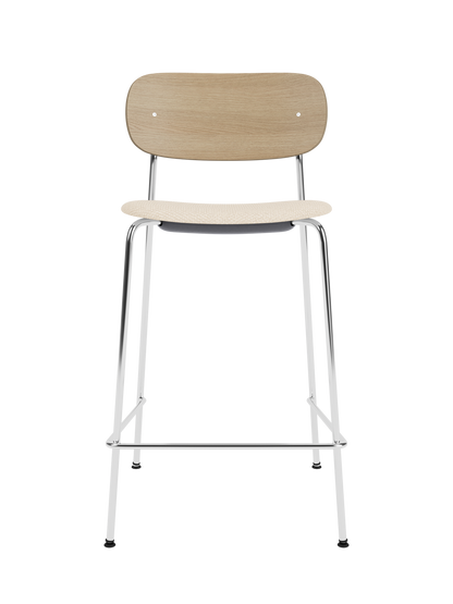 Co Counter Chair with a chrome steel frame, natural oak wood back, and Logan Jasmine upholstered seat.