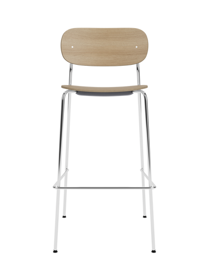 Co Bar Chair, Veneer in natural oak with a chrome steel frame, shown from a front angle on a black background.