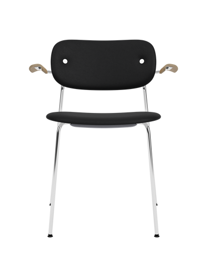 Fully upholstered Co Dining Chair with black Sierra 1001 leather, natural oak armrests and chrome legs.