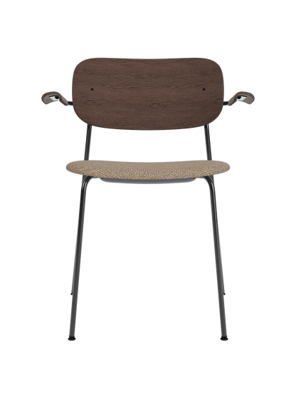 Co Dining Chair with armrests, featuring a dark stained oak backrest and Logan Flint upholstered seat on a black frame.
