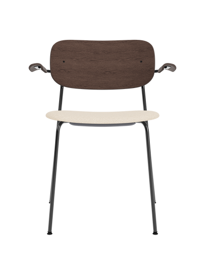 Co Dining Chair with armrests, black frame, dark stained oak backrest and beige Logan Jasmine upholstered seat.