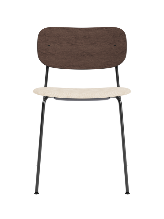 Co Dining Chair featuring a dark stained oak backrest and Logan Jasmin upholstered seat on a slim black metal frame.
