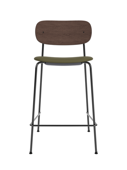 Co Counter Chair featuring a dark stained oak backrest, green Sierra 0441 upholstered seat, and black steel frame.