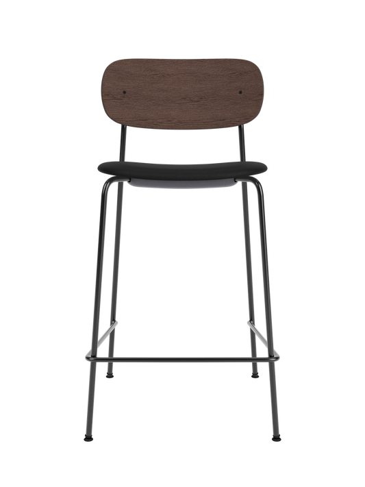 Co Counter Chair featuring a black upholstered seat, dark-stained oak backrest and slender black steel frame.