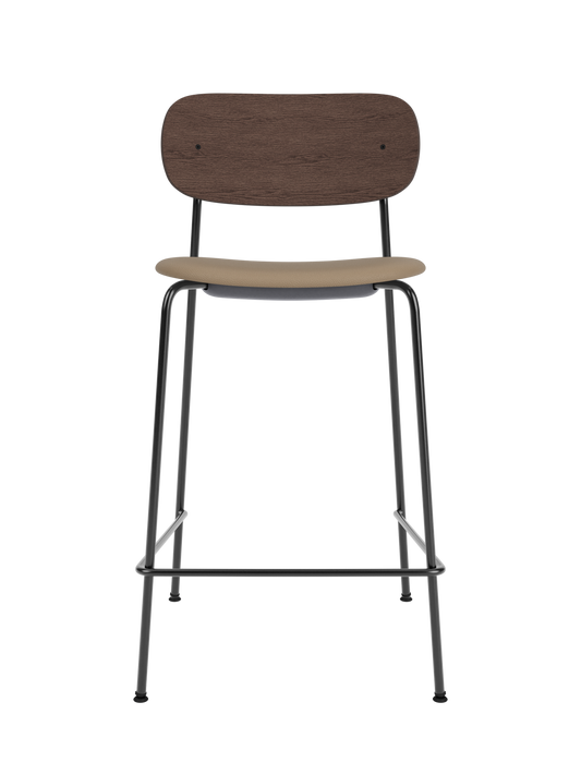 Co Counter Chair with a dark stained oak back and tan Sierra 1611 upholstered seat on a slim black steel frame.
