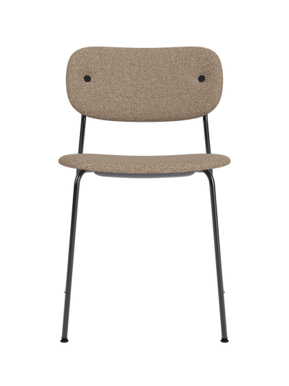 Fully upholstered Co Dining Chair in textured Logan Flint fabric with a sleek black steel frame and rounded back.