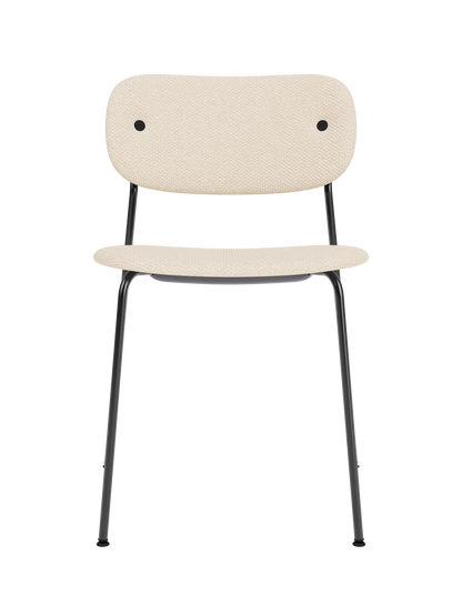 Co Dining Chair with fully upholstered Logan Jasmine fabric and a minimalist black powder-coated steel frame.