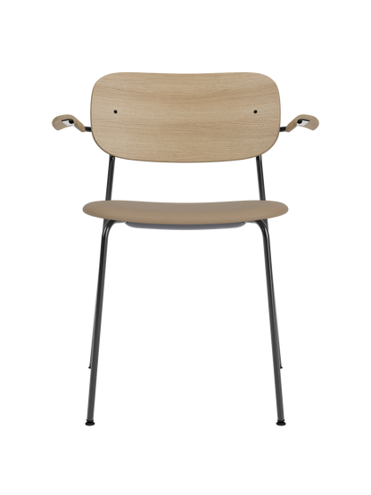 Co Dining Chair with armrests, featuring a natural oak back and tan Sierra 1611 upholstered seat on a black steel frame.