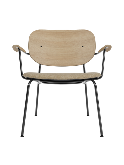 Co Lounge Chair with a natural oak backrest and beige bouclé seat on a slim black powder-coated steel frame.
