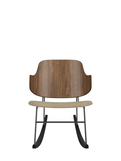 The Penguin Rocking Chair featuring a walnut veneer back and beige bouclé upholstered seat on a black steel frame.
