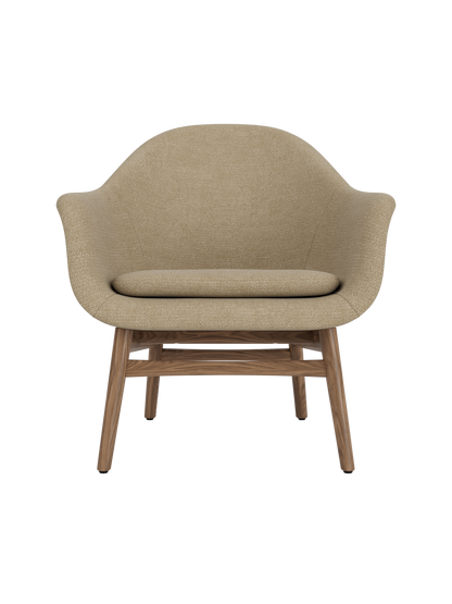Harbour Lounge Chair in beige Audo Bouclé 02 upholstery with a solid walnut wood frame and sculptural, curved shell.