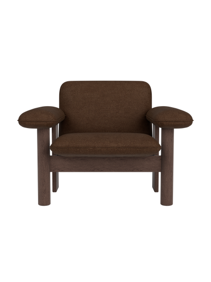 Brasilia Lounge Chair in dark brown bouclé upholstery with a low back and solid dark stained oak frame.