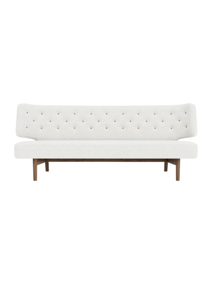 Radiohus Sofa P2 with light grey Hallingdal 65 0110 upholstery, solid walnut legs and quilted leather buttons.