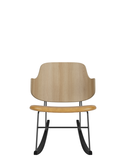 Natural oak backrest and tan leather seat on The Penguin Rocking Chair with a minimalist black steel frame and rockers.