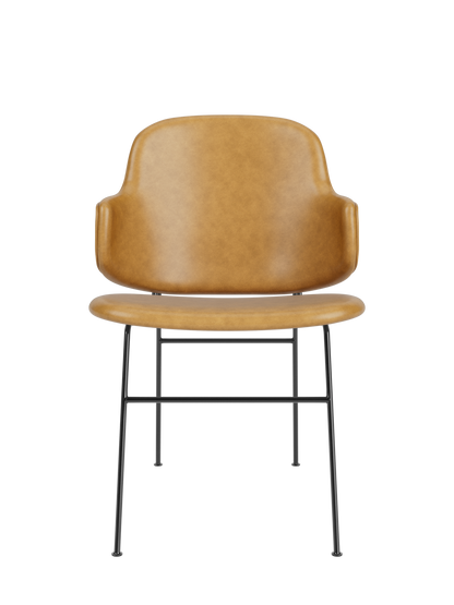 The Penguin Dining Chair in tan upholstery, featuring a mid-century contoured back and slim black steel legs.