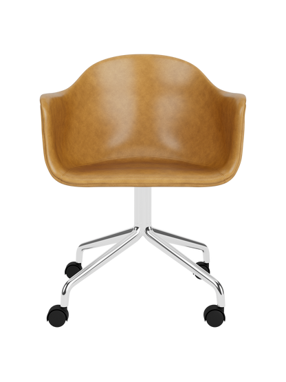 Harbour Dining Chair in tan Dakar leather with a polished aluminium star base and black casters.