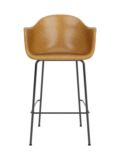 Tan leather Harbour Bar Chair in Dakar 0250 with a sculptural seat and slim black powder-coated steel legs.