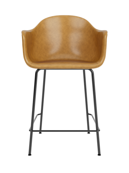 Harbour Counter Chair with a tan Dakar upholstered seat and slender black steel frame, viewed from the front.