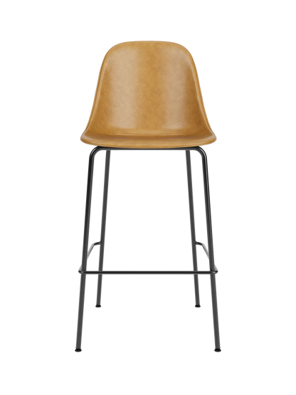 Harbour Side Bar Chair upholstered in tan Dakar leather with a slender black steel base and footrest.