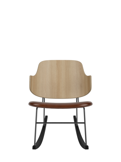 The Penguin Rocking Chair with a curved natural oak back, brown leather seat and black steel frame on rockers.