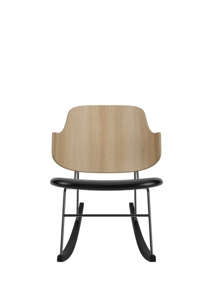 The Penguin Rocking Chair with a curved natural oak back and black leather seat on black steel rockers.
