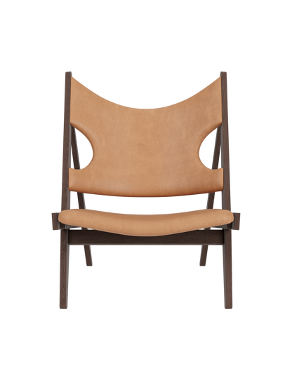 Knitting Lounge Chair in dark stained oak and Dunes Camel leather featuring signature ergonomic elbow cut-outs.