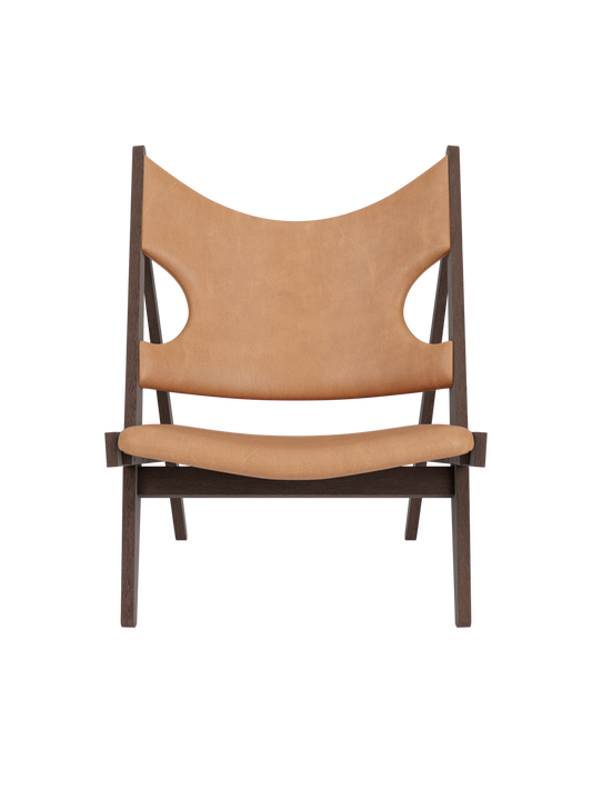 Knitting Lounge Chair in dark stained oak and Dunes Camel leather featuring signature ergonomic elbow cut-outs.