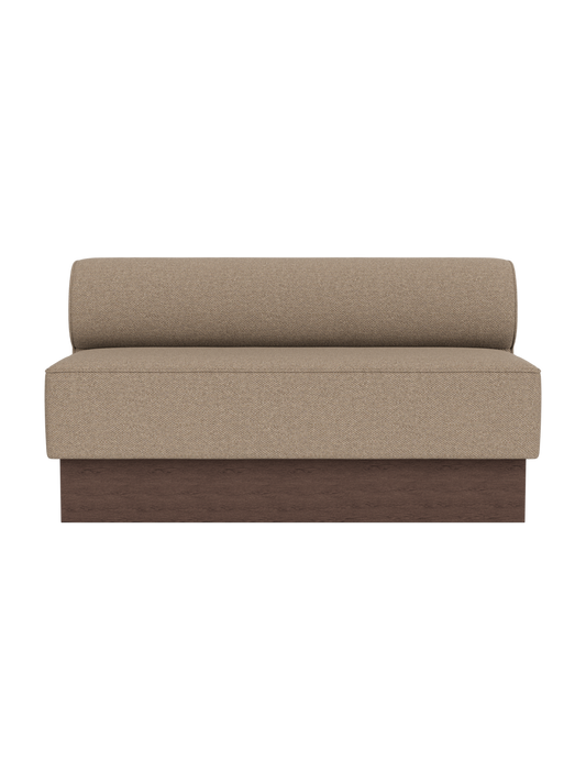 The Eave Dining Sofa, Plateau upholstered in Logan Flint fabric with a dark stained oak base, viewed from the front.