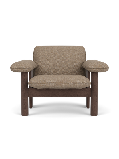 Front view of the Brasilia Lounge Chair, Low Back. Features dark stained oak frame and plush Logan Flint textile upholstery.