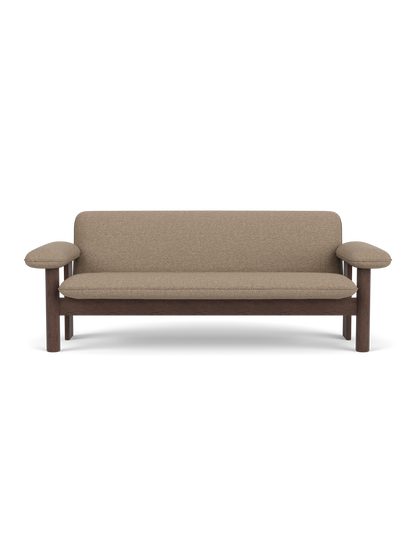 Front view of the Brasilia Sofa with a Dark Stained Oak frame and light brown Logan Flint upholstery on a black background.