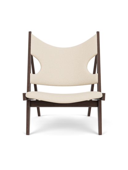 Front view of the Knitting Lounge Chair, with a dark stained oak frame upholstered in a light jasmine textile.