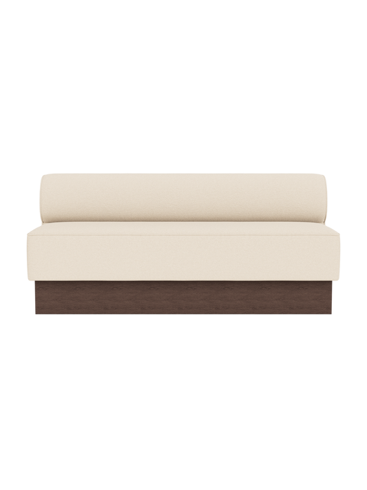 Eave Dining Sofa in Logan Jasmine upholstery with a dark stained oak base, shown from the front.
