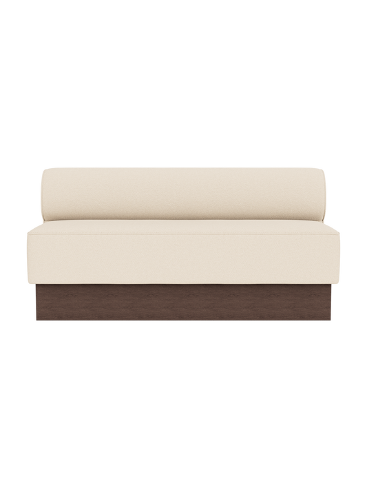 Eave Dining Sofa, Plateau in Logan Jasmine upholstery with a dark stained oak base, viewed from the front.