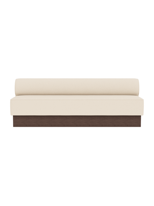 Eave Dining Sofa, Plateau in Logan Jasmine upholstery with a dark stained oak base, viewed from the front.