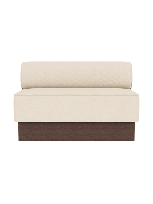 Eave Dining Sofa, Plateau in Logan Jasmine upholstery featuring a dark stained oak base, viewed from the front.